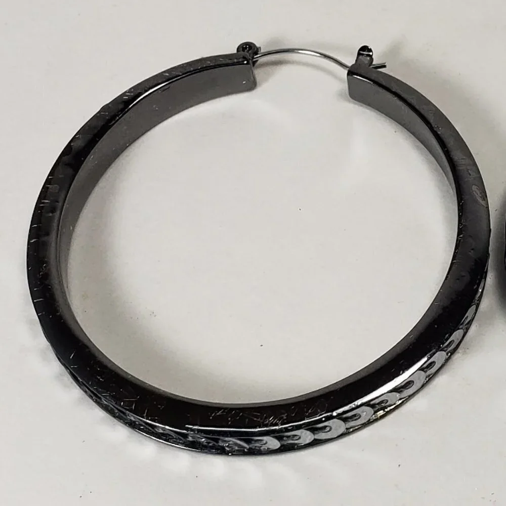 Women's Black Hoop Earrings with Polished Finish and Silver Tone Disc Accents